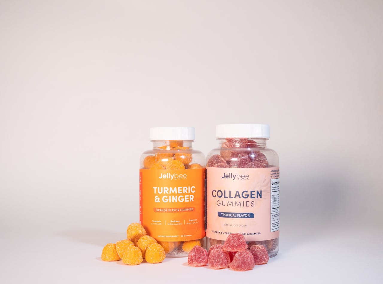 Vibrant product image of Jellybee Turmeric & Ginger and Collagen gummies on a white surface.
